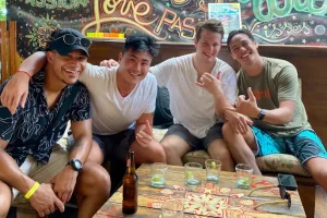 Bachelor party group with drinks at El Be! beach club in Tamarindo, Costa Rica