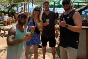 Friends with drinks at El Be! beach club on Tamarindo beach, Costa Rica